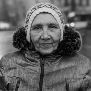 Photo of woman in coat with knit cap