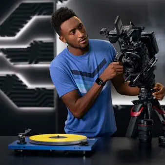 Marques with camera equipment and a record player. 