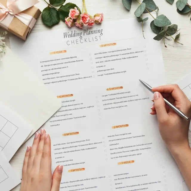 Looking down on wedding checklist on table