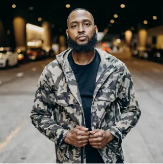 Photo of man standing in street